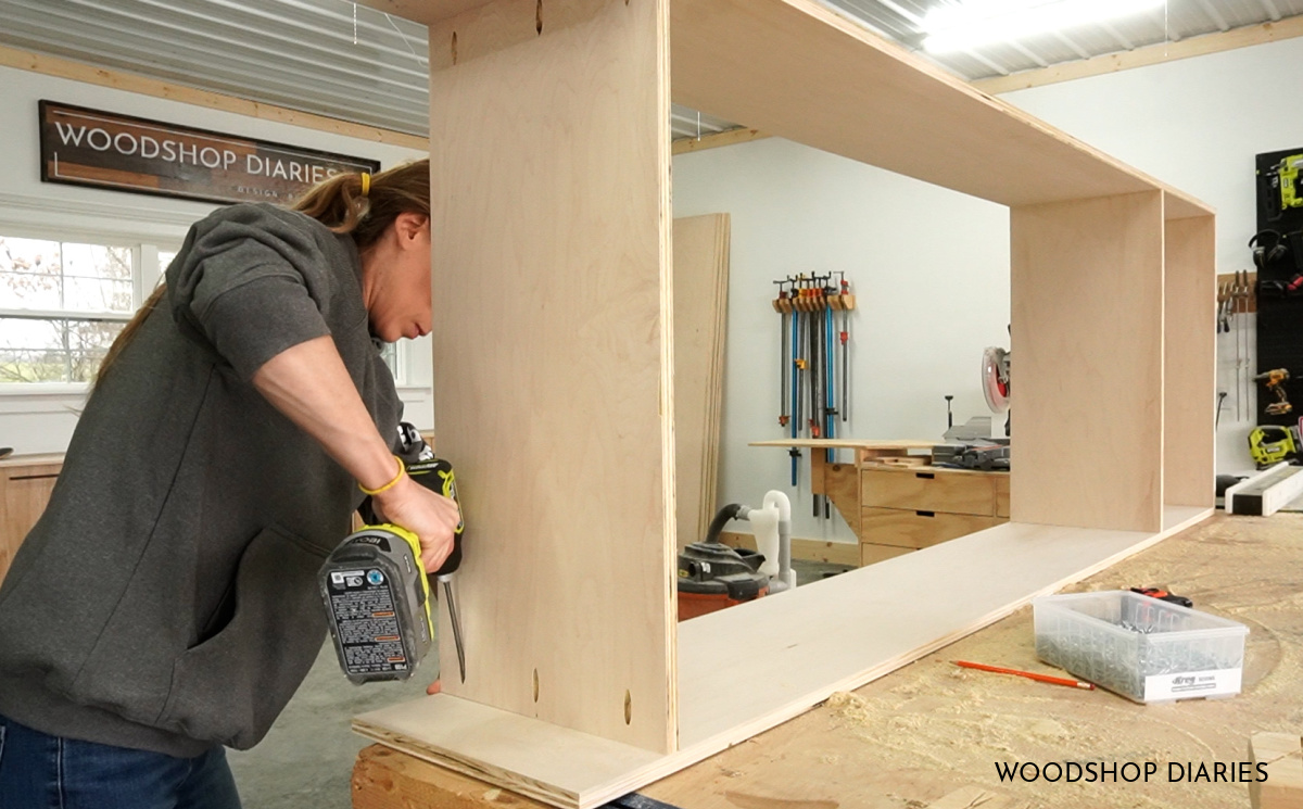 Shara Woodshop Diaries assembling library bookshelf cabinet on workbench using pocket holes