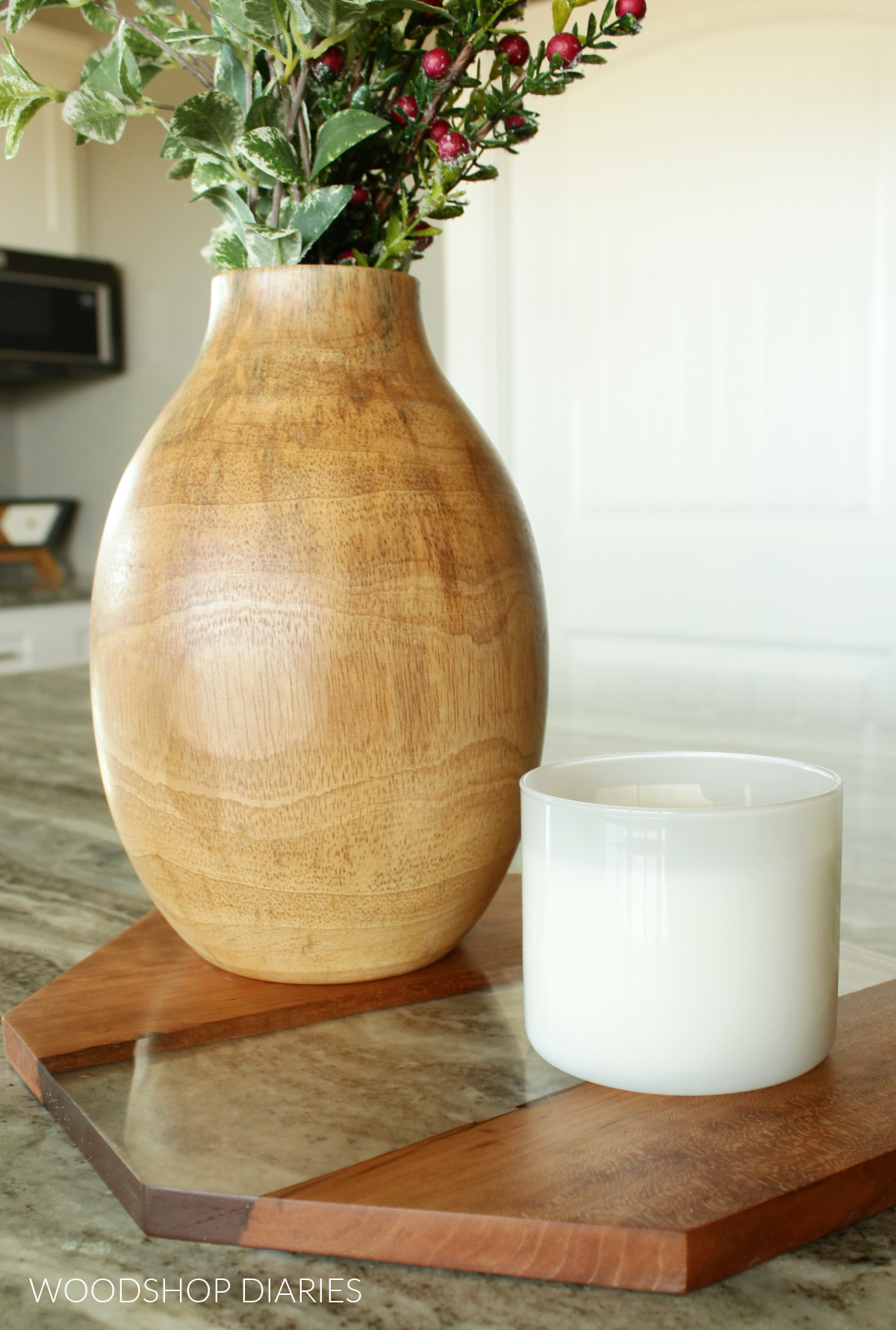 Polished easy beginner epoxy and wood project on granite kitchen island with vase on top