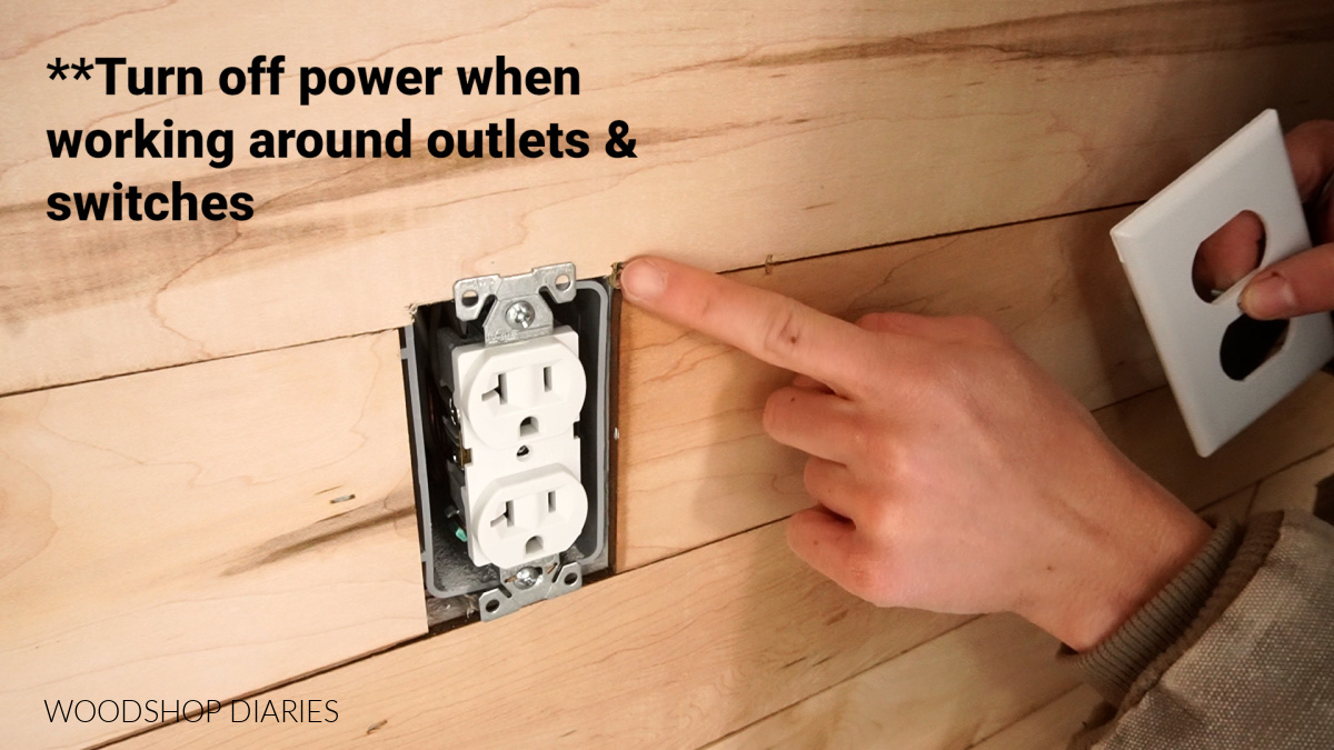 Close up of boards cut to fit around outlet box