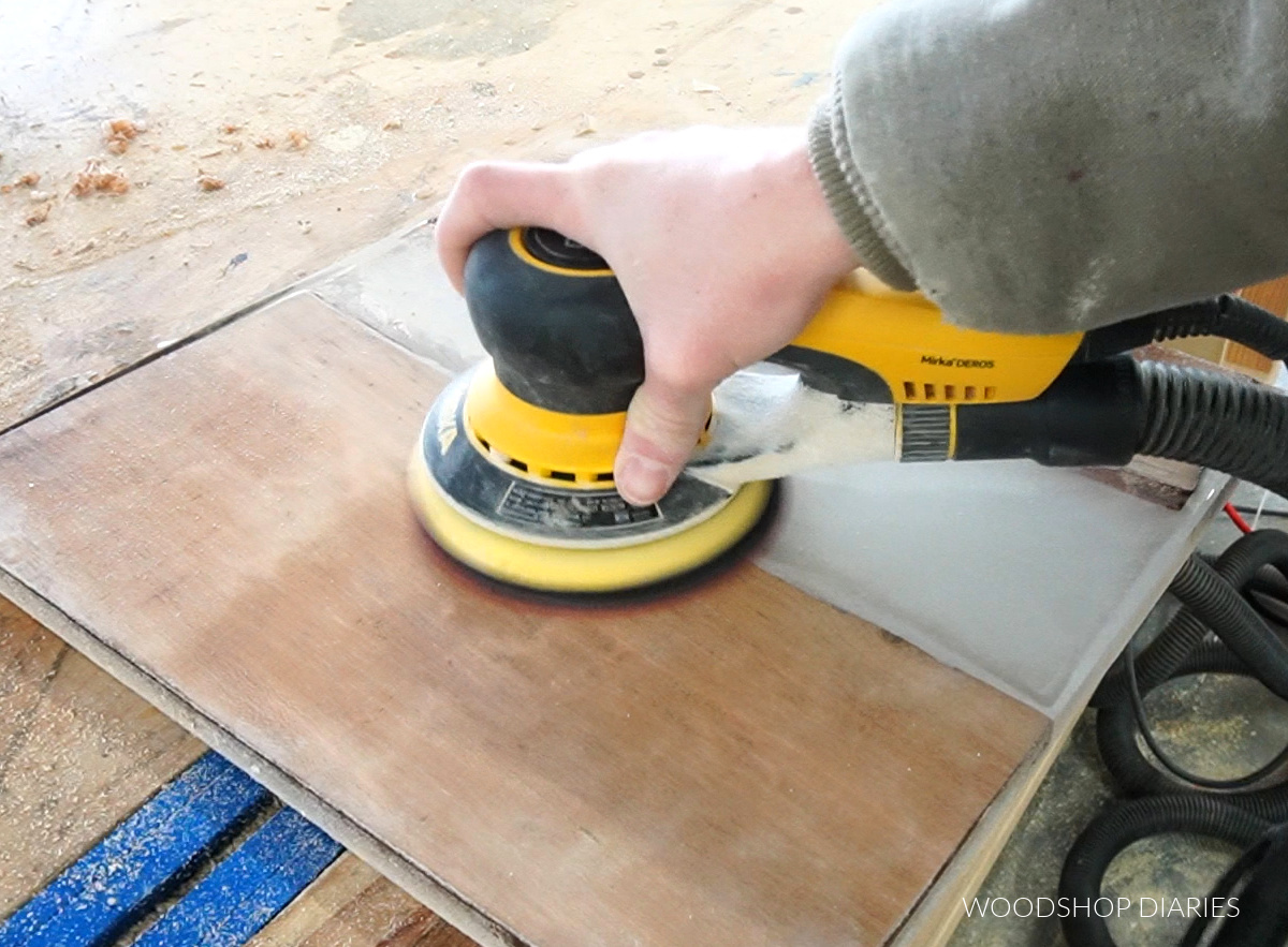 Sanding epoxy resin and wood with orbital sander