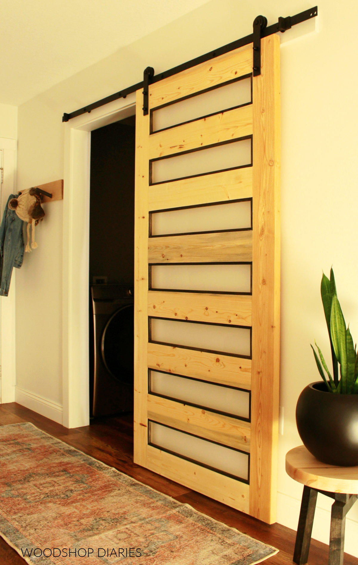 Modern frosted glass sliding door on laundry room entrance