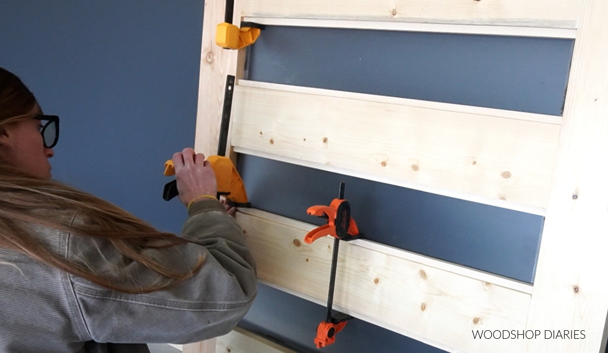 Shara Woodshop Diaries gluing square dowels on back side of sliding door to keep plexiglass panels in place