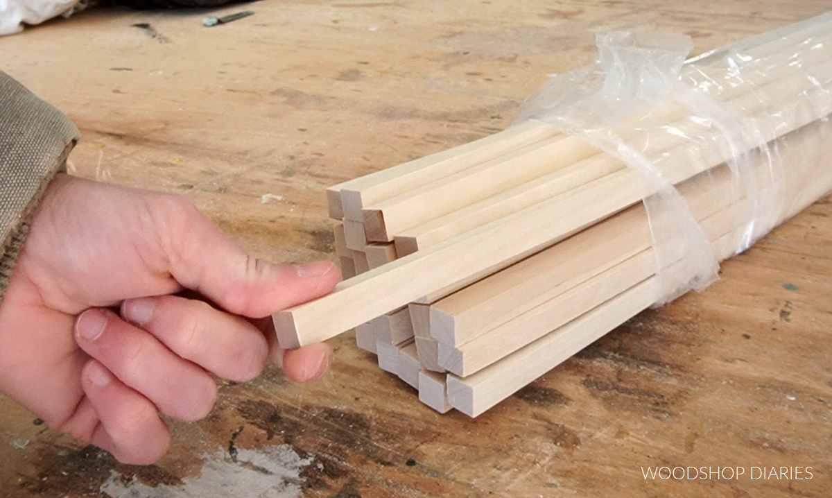 Close up of ½" square dowels on workbench