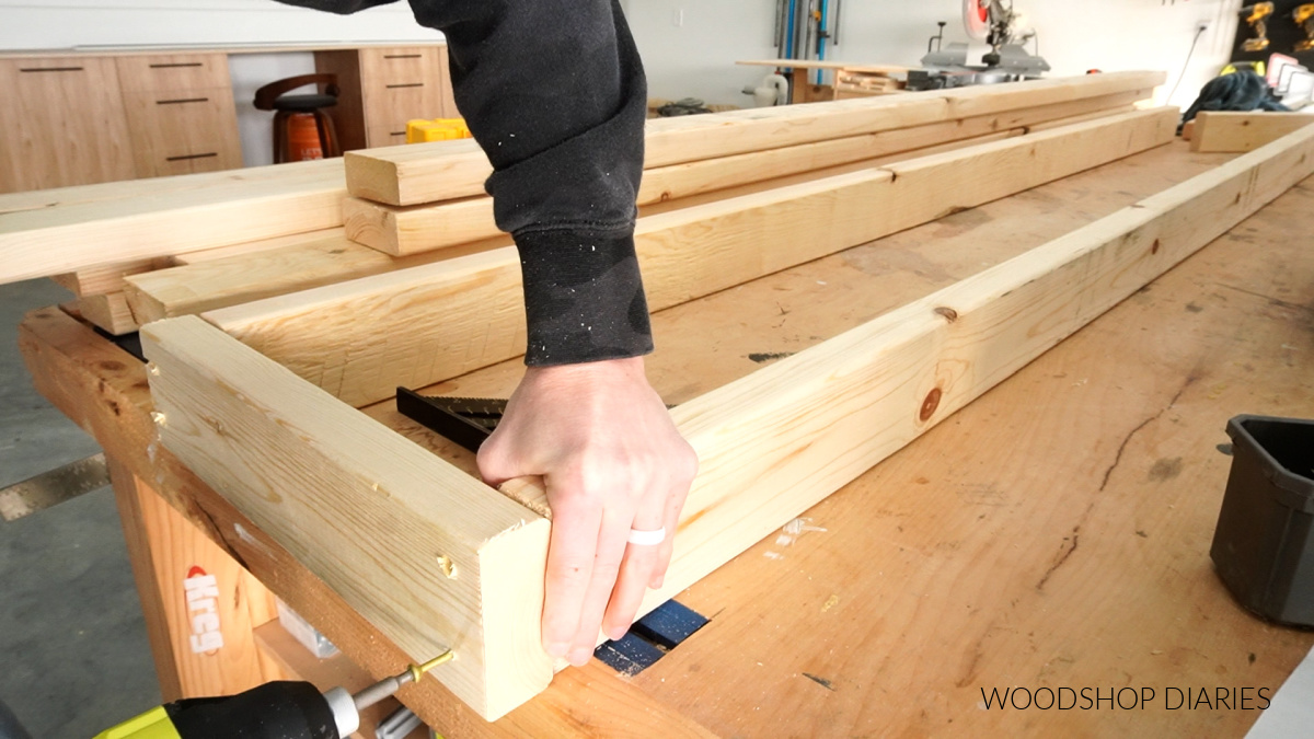 Close up of screwing together 2x4 stud wall for fireplace