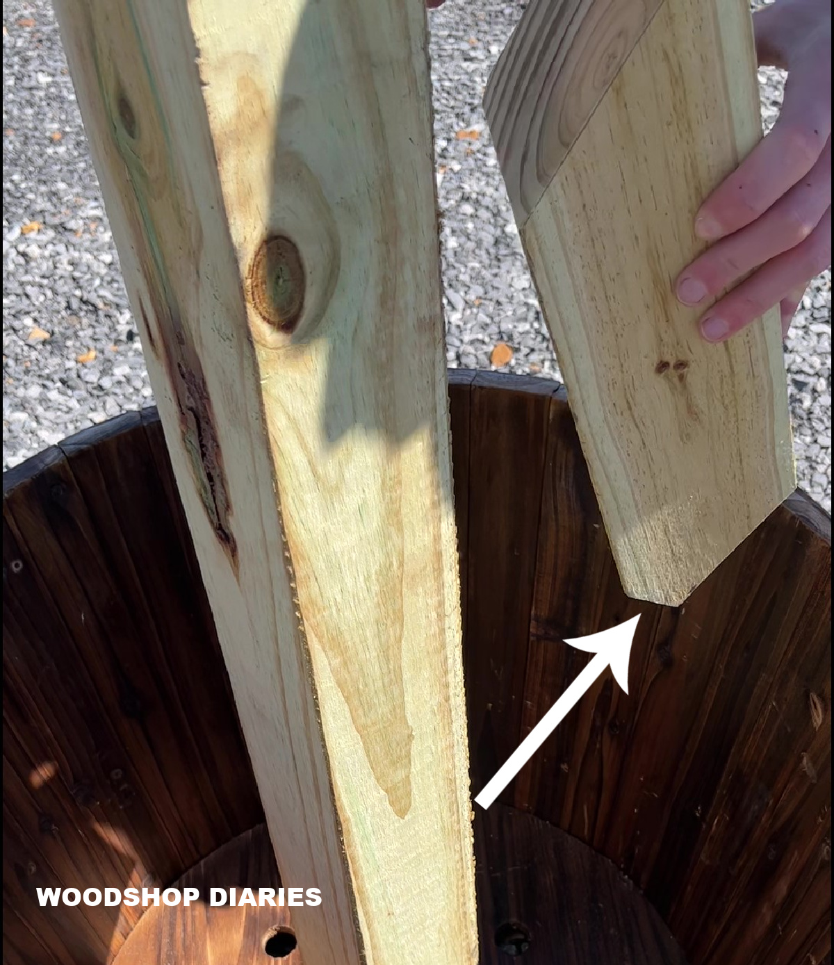 Placing corner supports posts into barrel