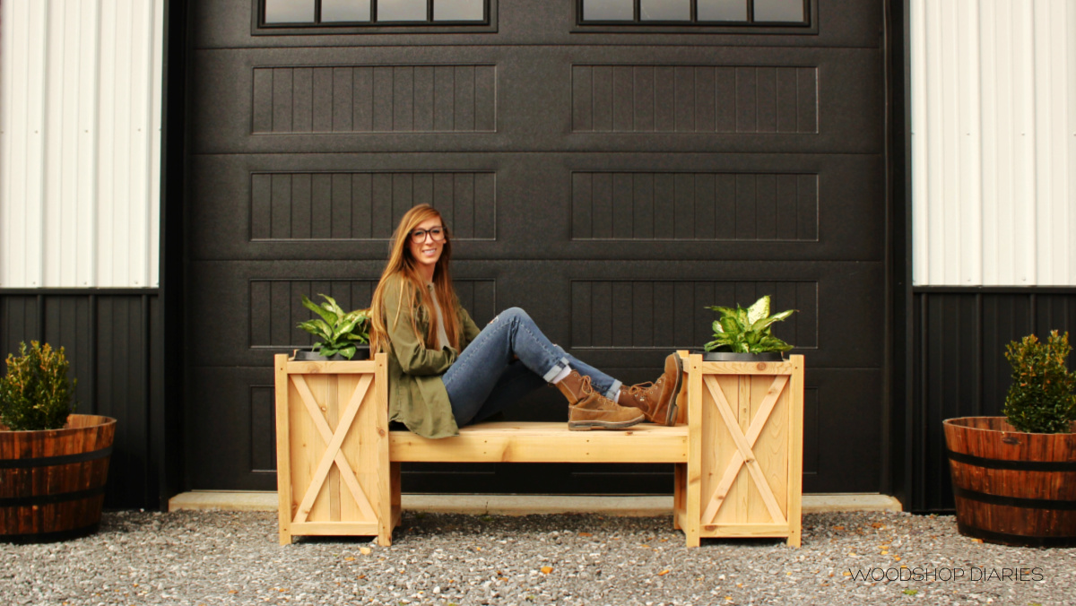 Shara sitting on planter bench