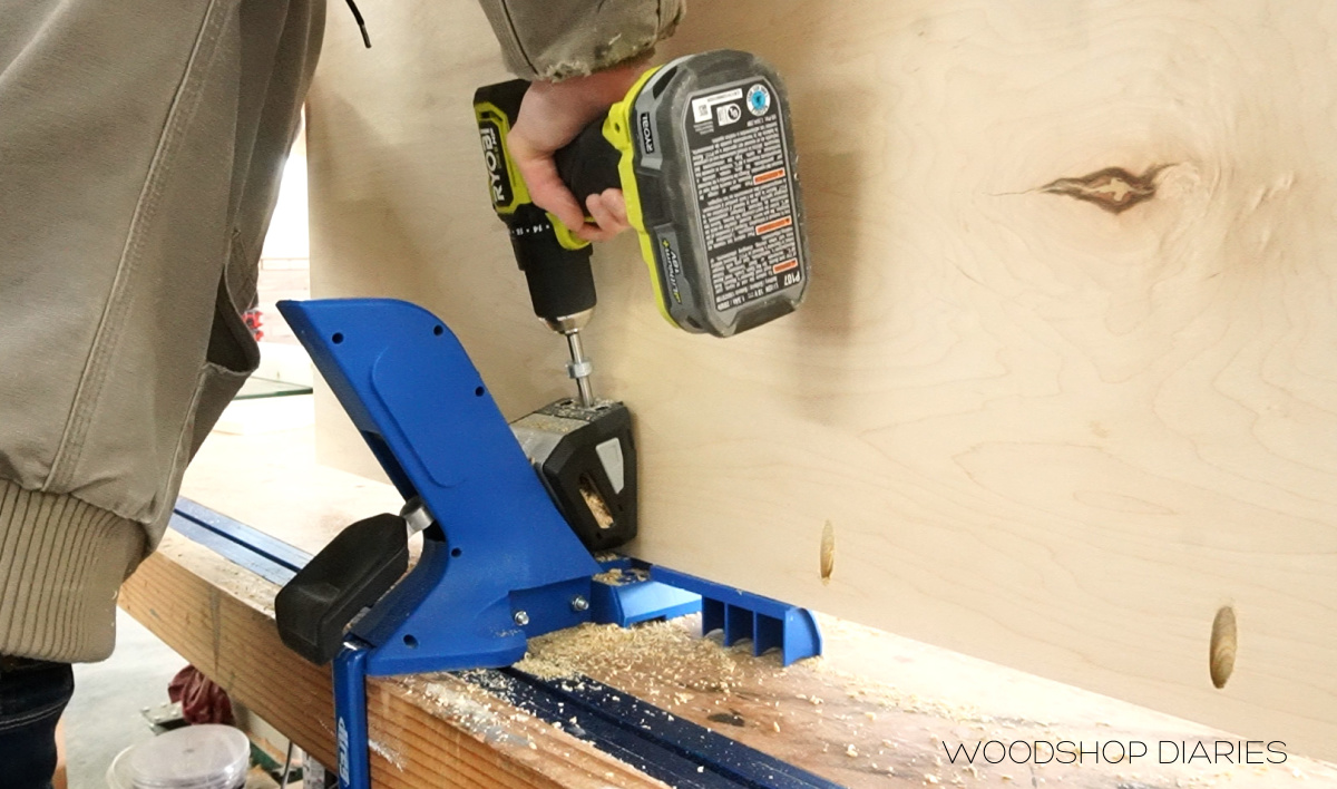 Shara drilling pocket holes into plywood panel on Kreg 720 jig