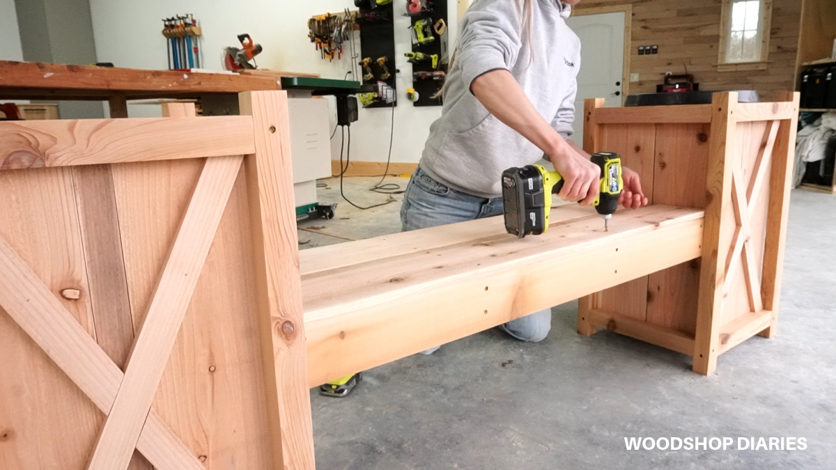 Shara Woodshop Diaries screwing bench seat slats onto bench frame