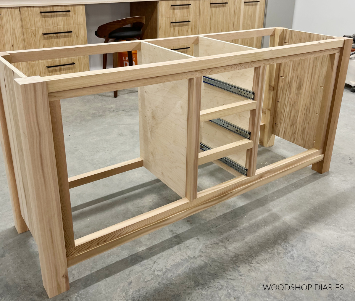 drawer slides installed onto center section of vanity directly above drawer dividers