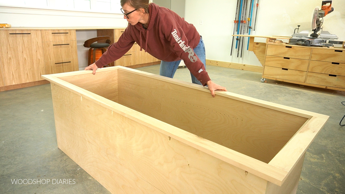 Shara Woodshop Diaries installing face frame onto closet cubby box