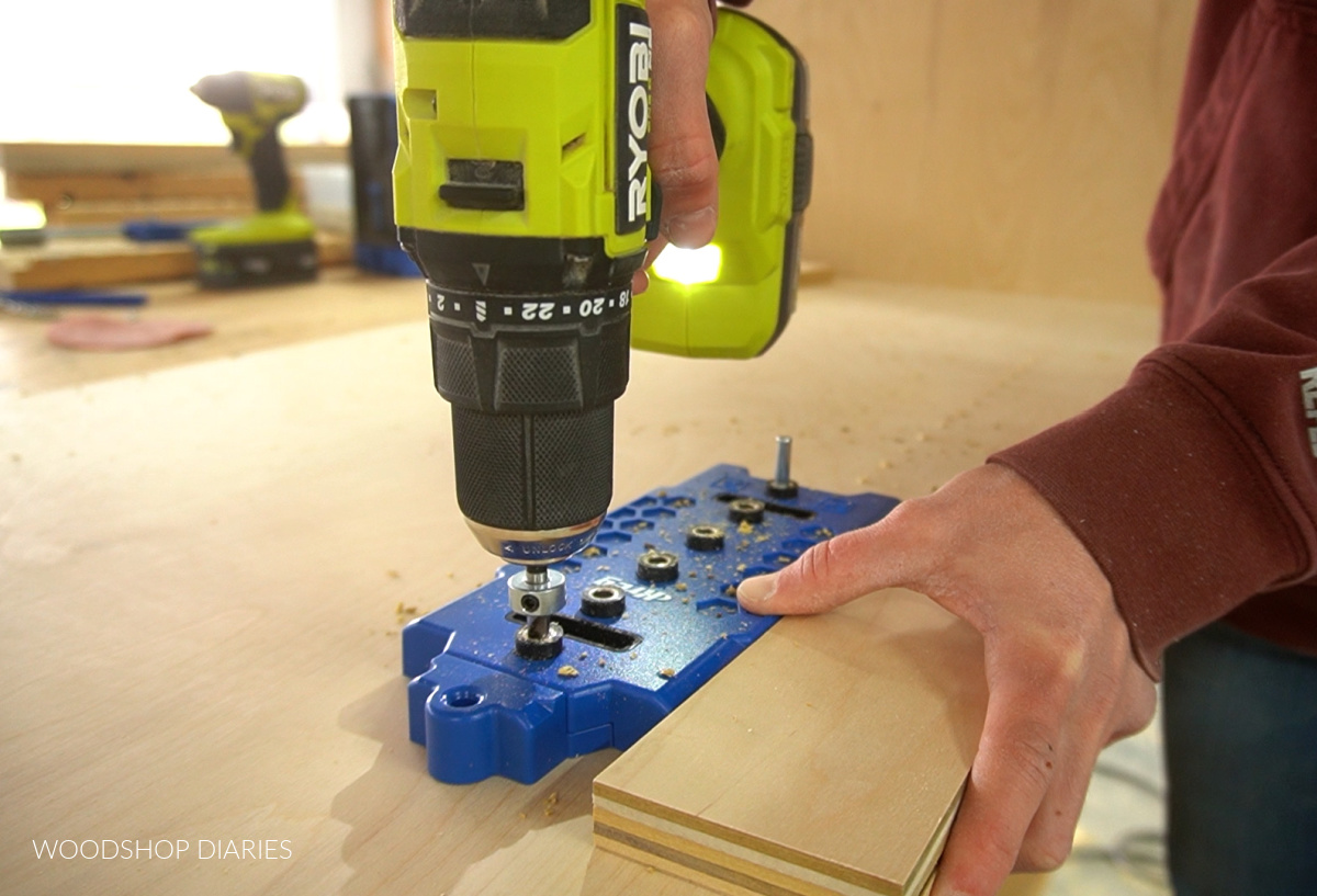 Shara Woodshop Diaries using shelf pin jig to drill shelf pin holes on plywood box