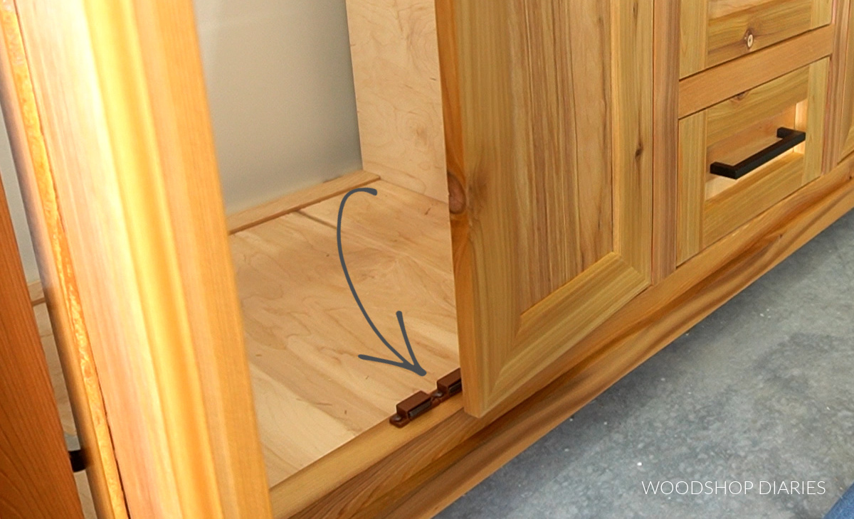 magnetic catches installed on bottom of bathroom vanity