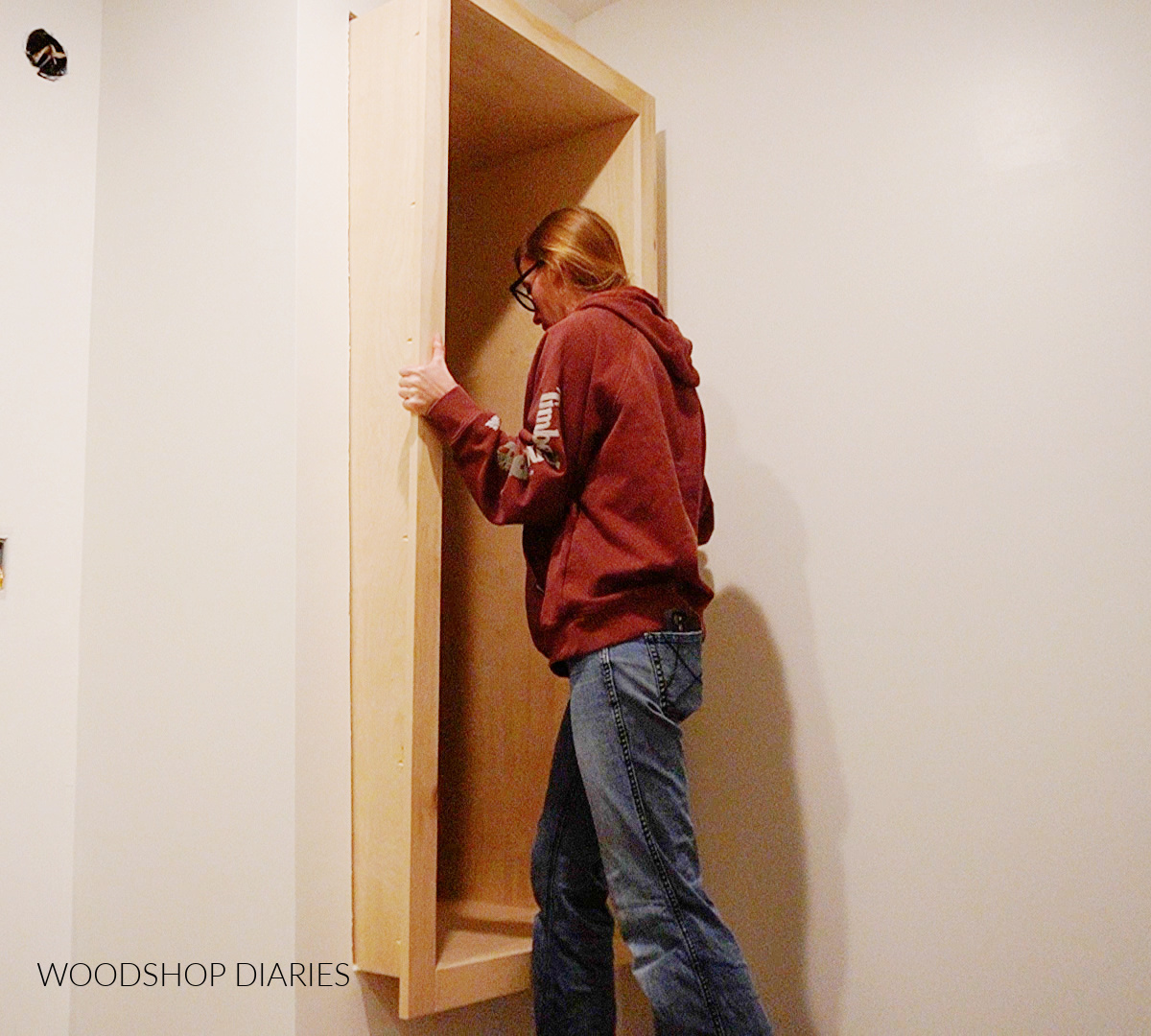 Shara Woodshop Diaries sliding built in cubby box into closet opening