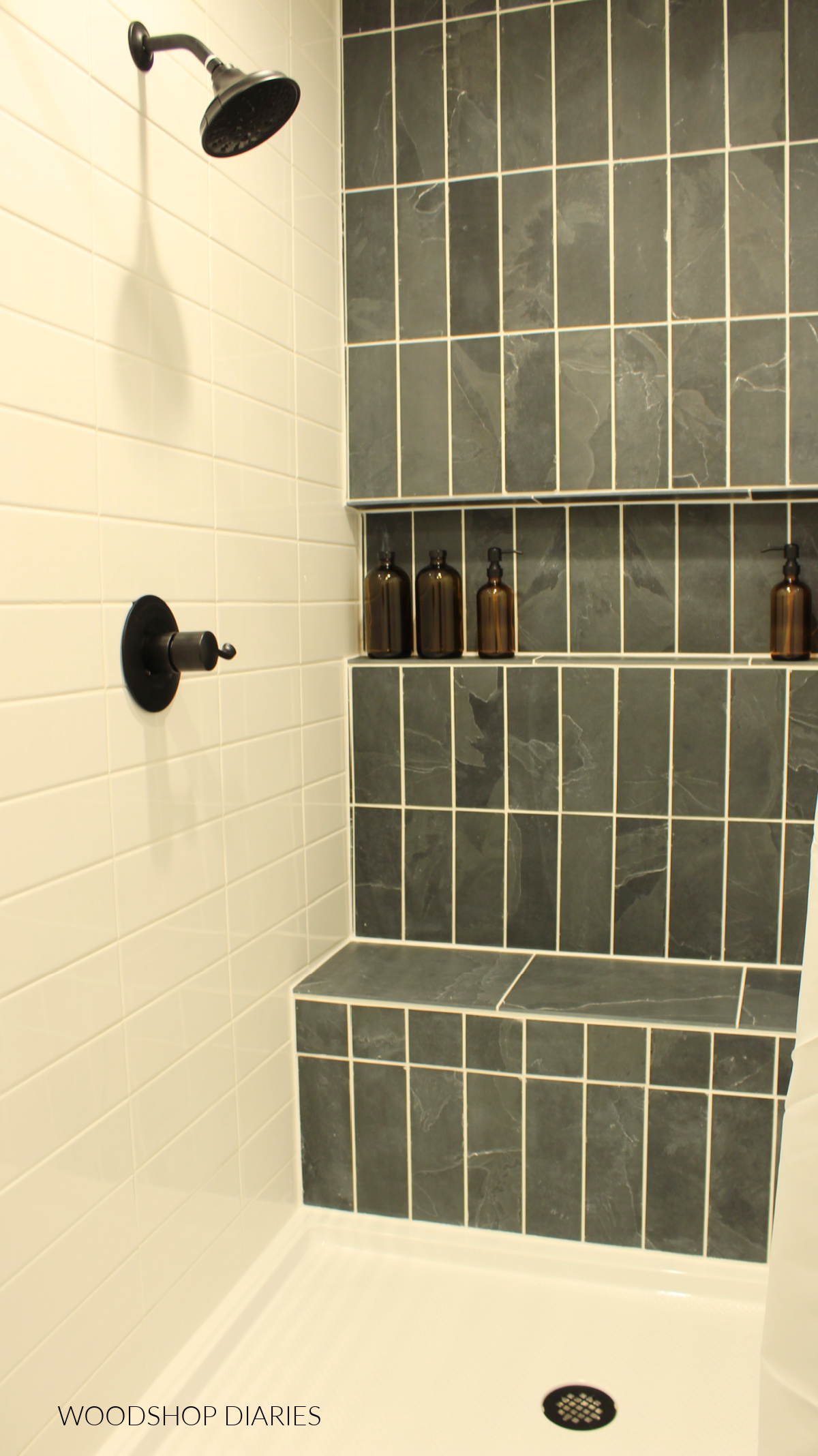 Charcoal and White tile shower with full length shelf niche and bench seat