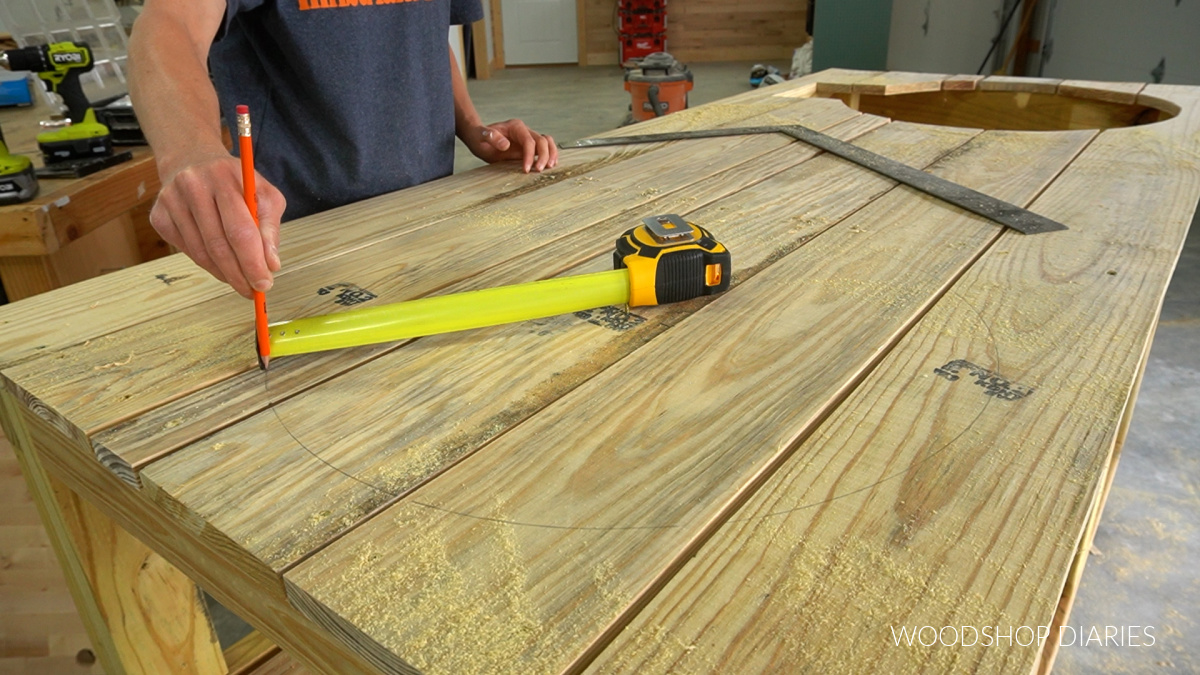 Shara Woodshop Diaries using a tape measure to draw circle on top boards for ceramic grill cut out