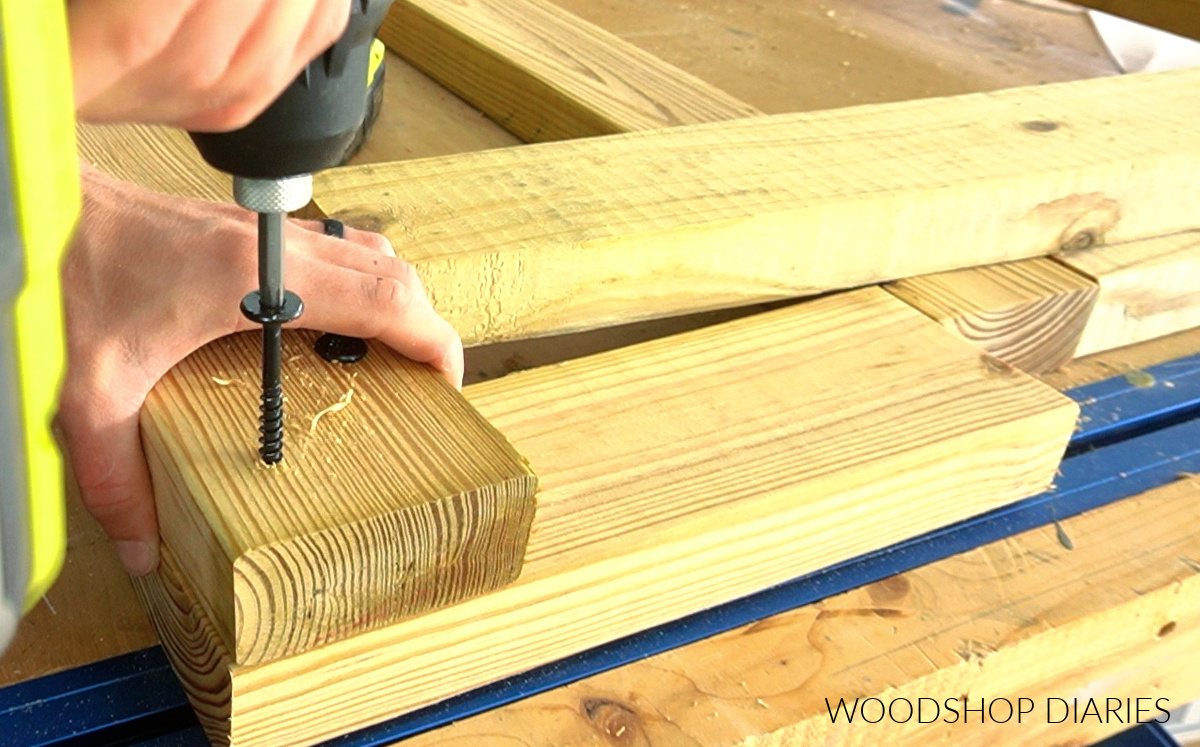 Close up of timber screws being used on cart frame corner