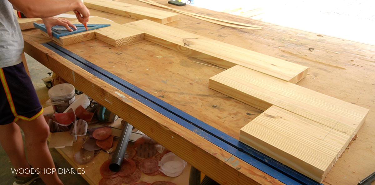 Shara Woodshop Diaries marking on boards pieced together in a "U" shape on workbench