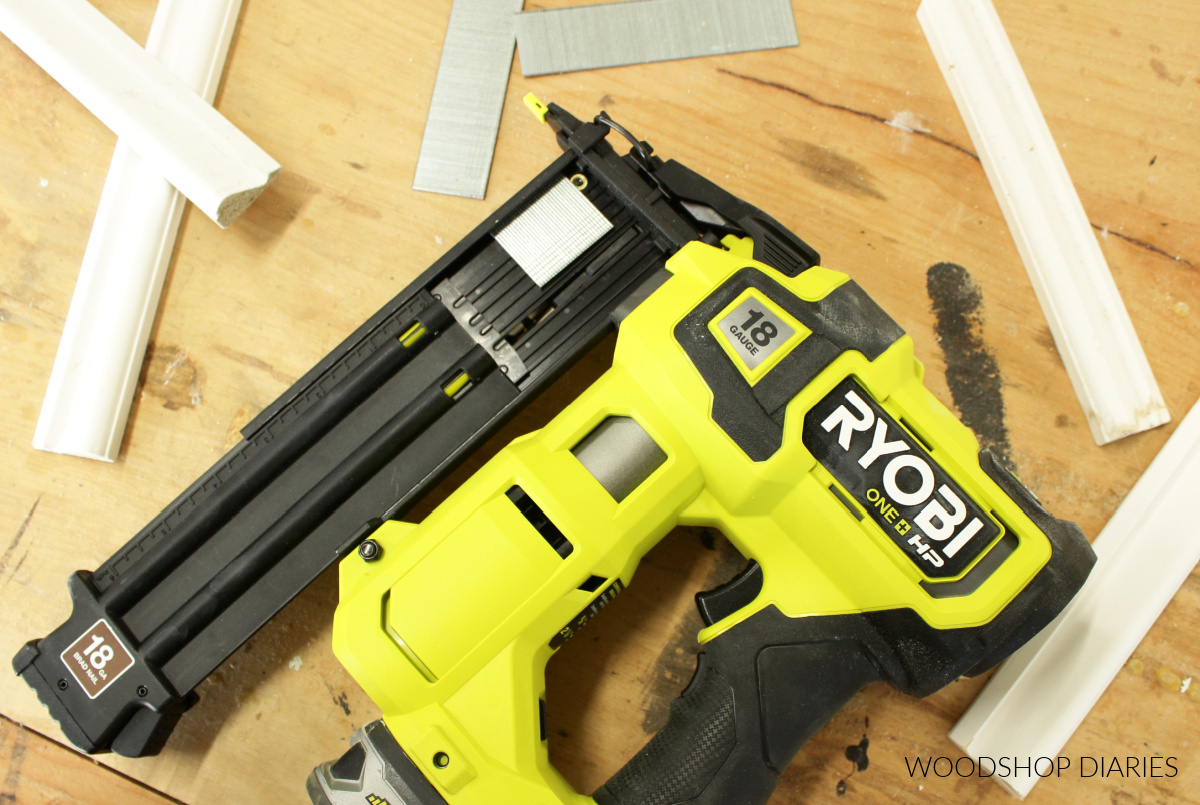 Close up of Ryobi HP AirStrike 18 ga nail gun on workbench