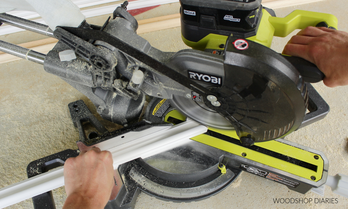 Using cordless miter saw to cut base cap molding at 45 degree miter