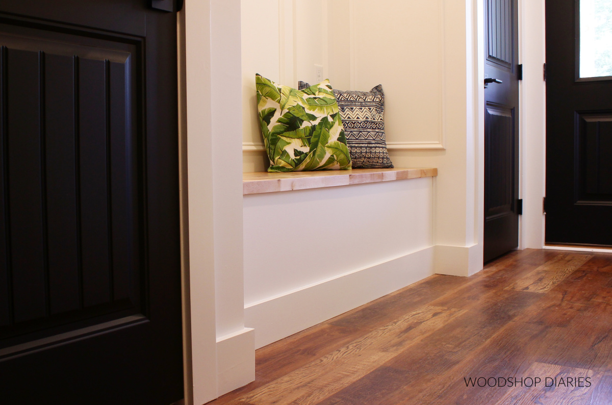 Close up of built in storage bench in hallway nook after hallway makeover