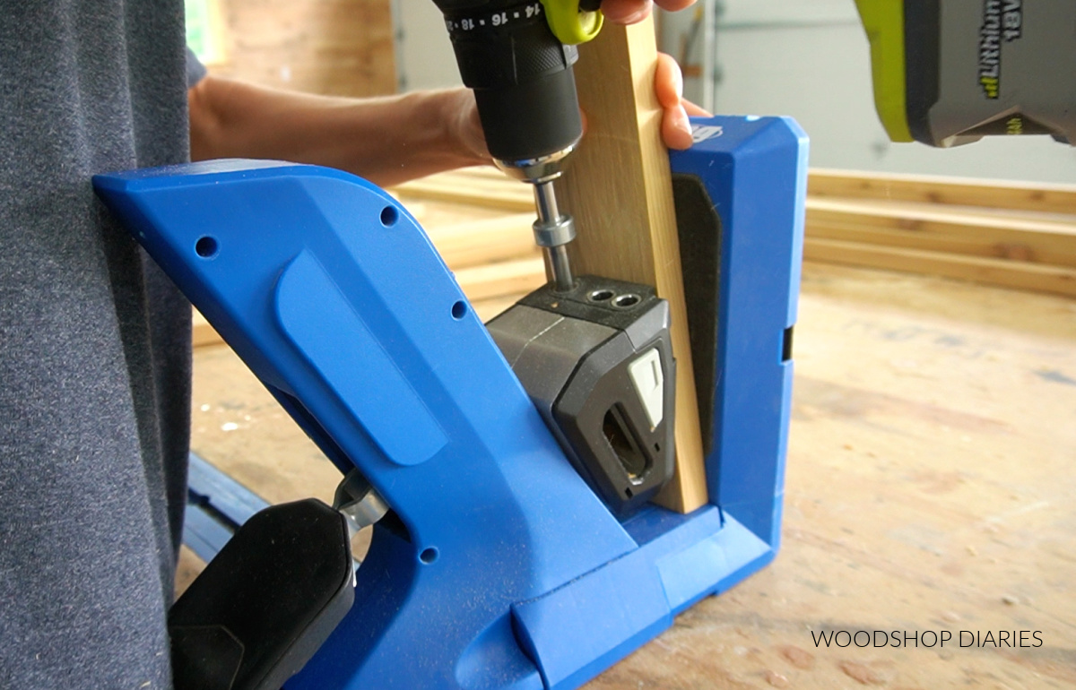 Close up of drilling pocket hole in angled board with Kreg 720 pocket hole jig