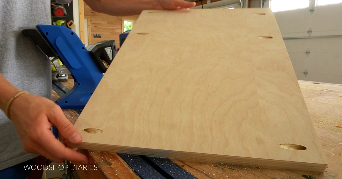 Pocket holes drilled in sides of plywood panel close to top and close to bottom