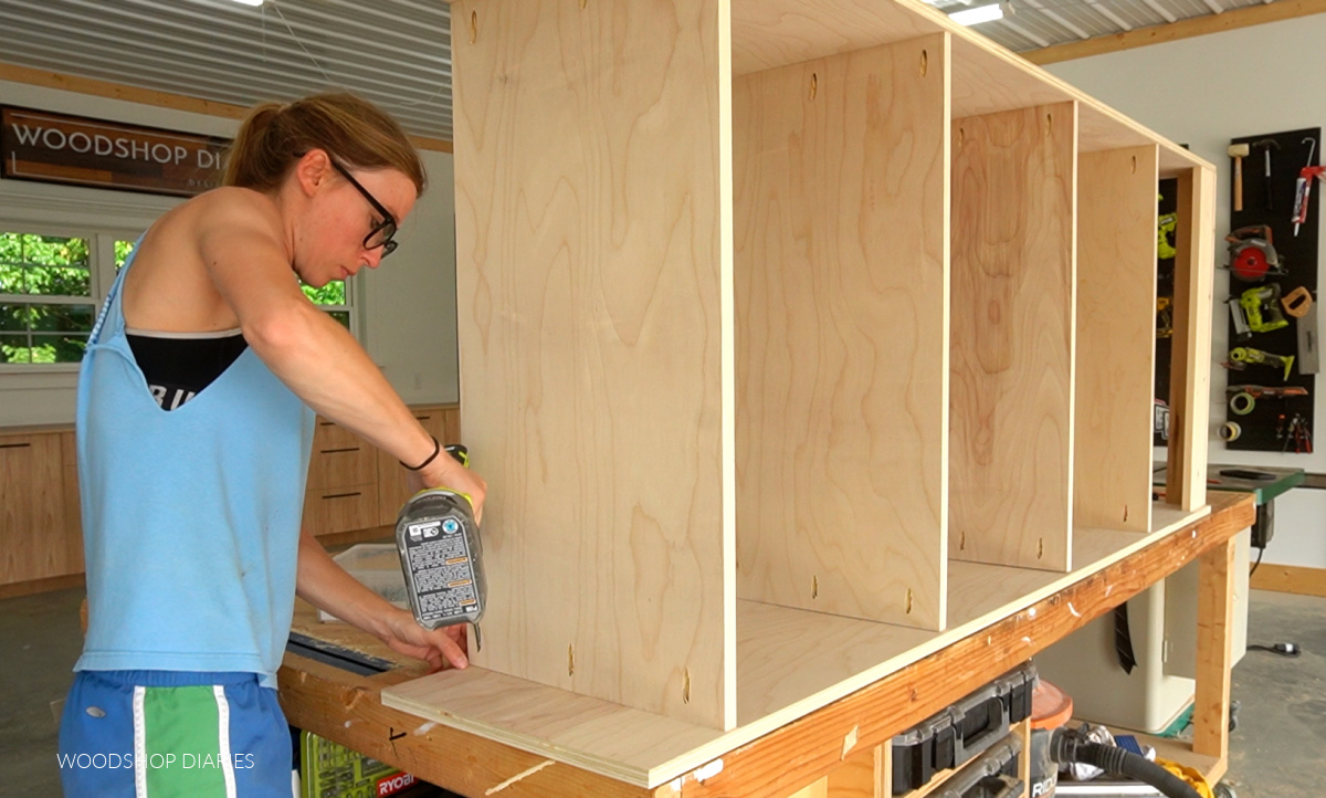 Shara Woodshop Diaries assembling bookshelf cabinet on workbench using pocket holes and screws