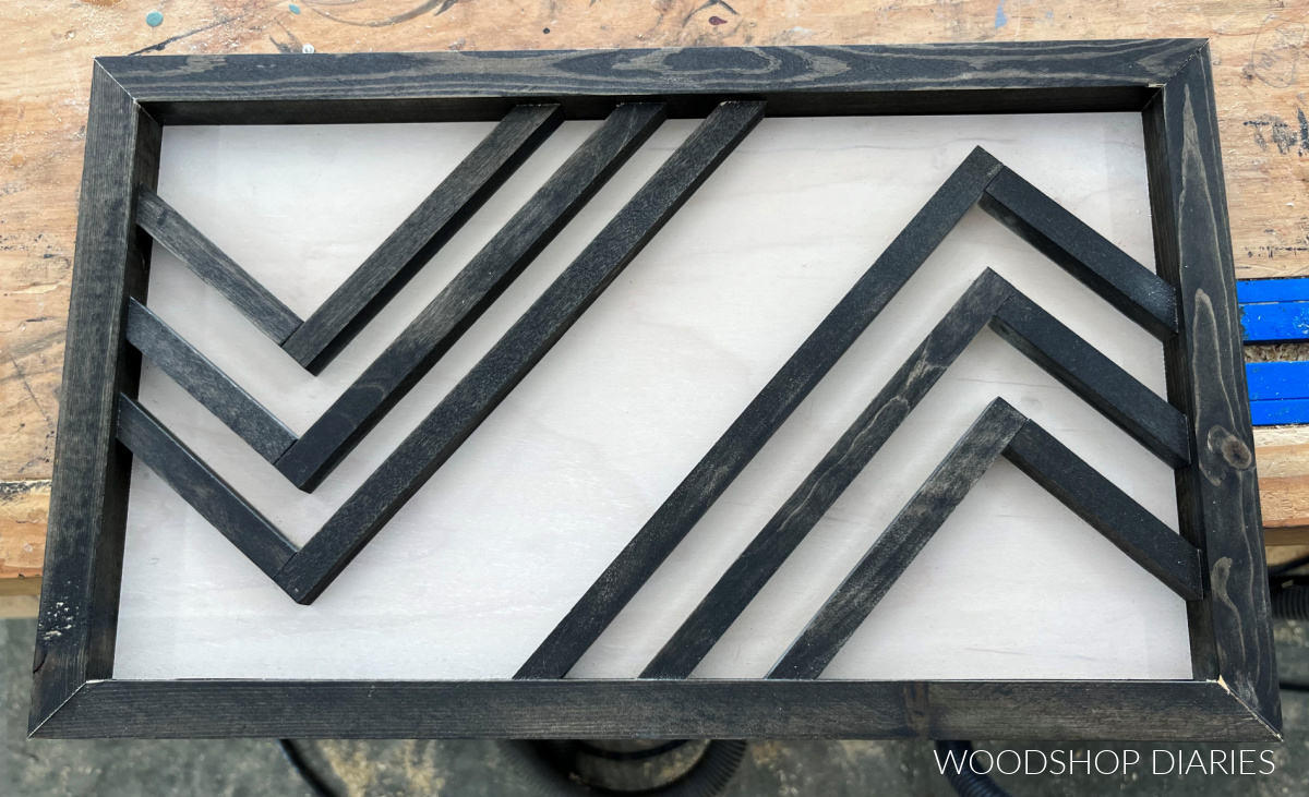 completed black and white DIY geometric wooden art close up