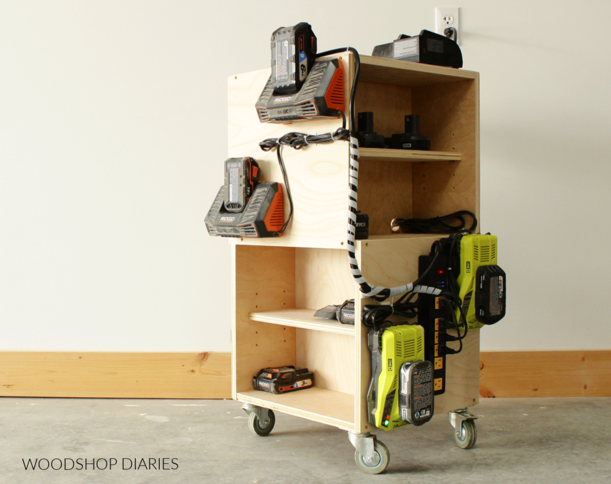 Plywood shop cart with wheels with battery chargers mounted on sides