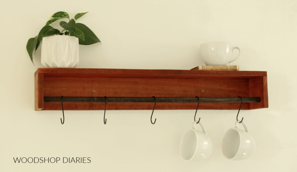 wall shelf with dowel rod and hooks