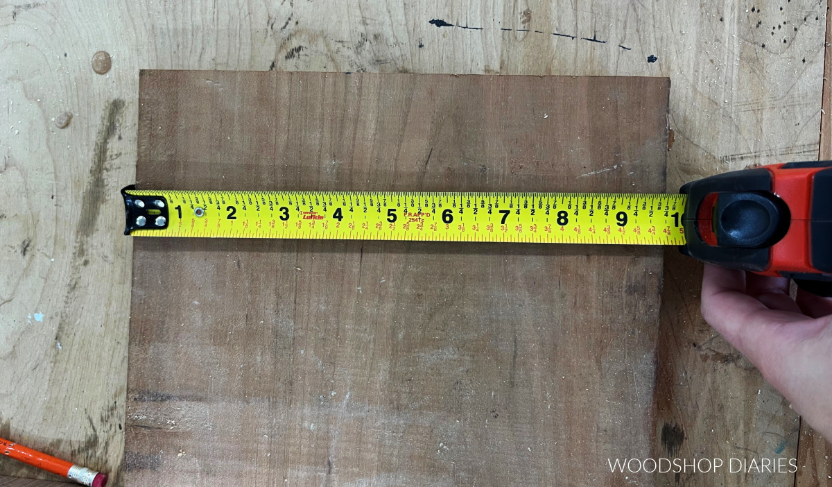 Measuring tape measuring 9 ¾" wide board