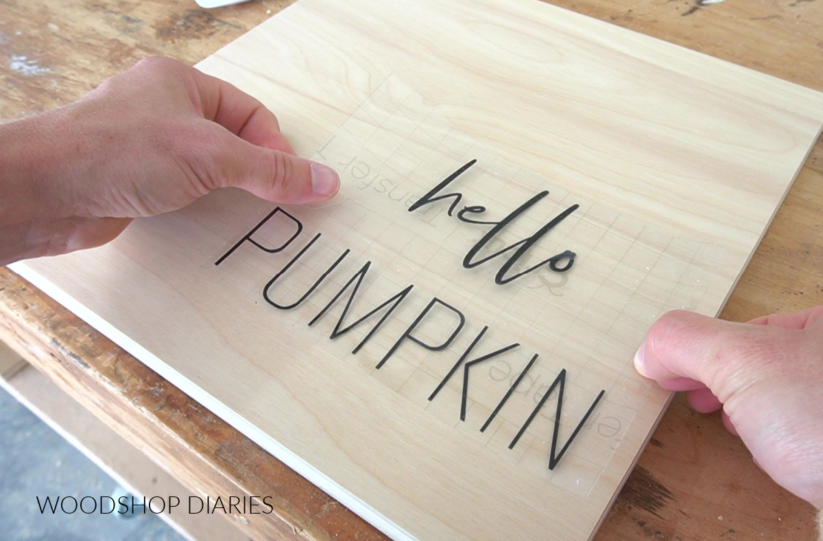 Applying hello pumpkin text to wood art plywood surface