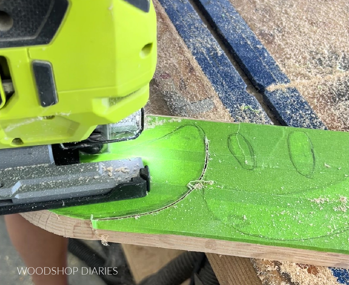 Jig saw cutting out pumpkin cut out shapes on oak board