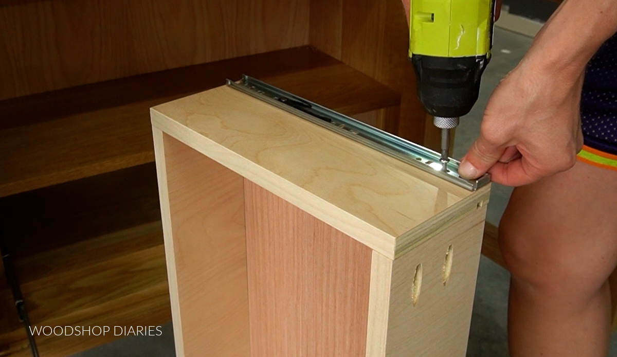 Screwing bracket from drawer slide into side of drawer box