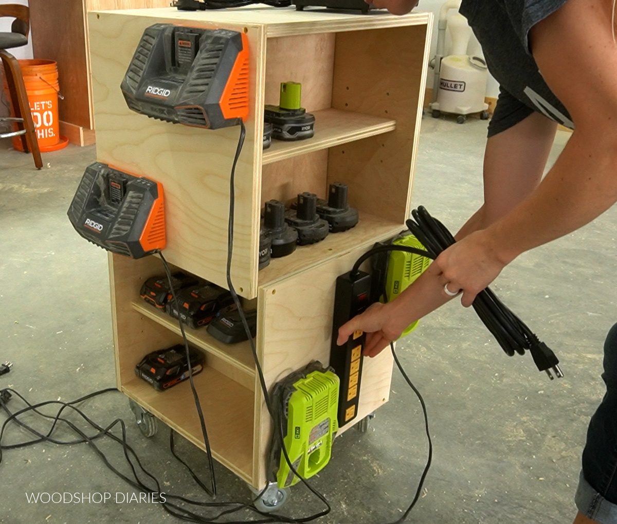 Installing power strip on side panel of mobile battery charging station
