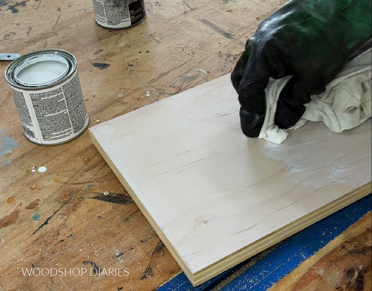 Applying white stain to back plywood panel board