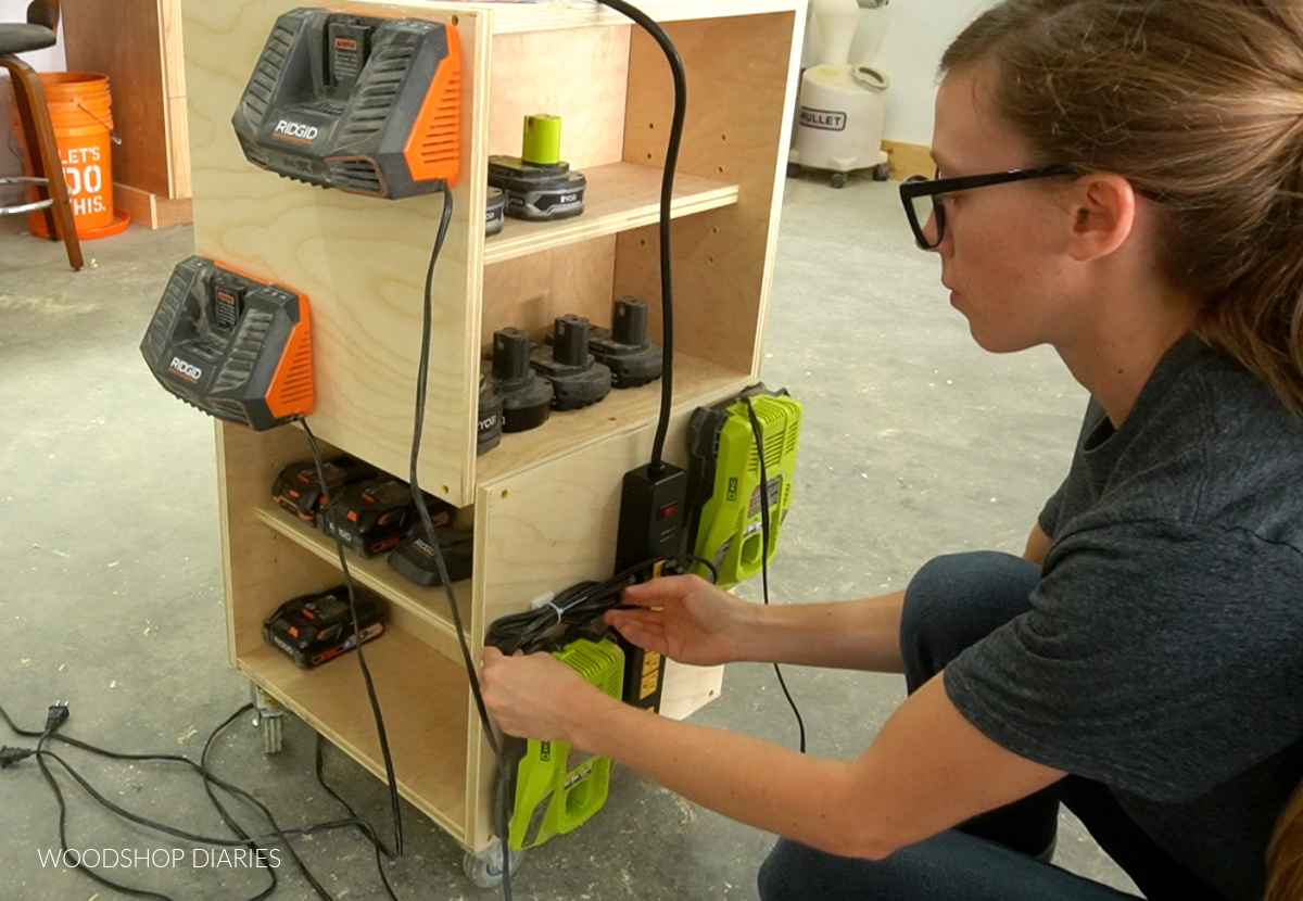 Managing cords using zip ties on side panels of mobile battery charging station