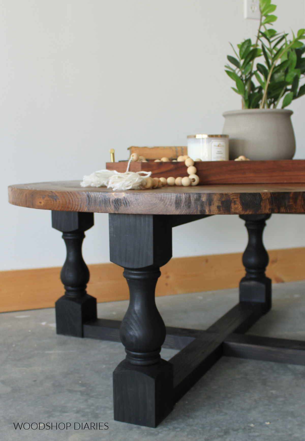 Close up of round coffee table top with black base