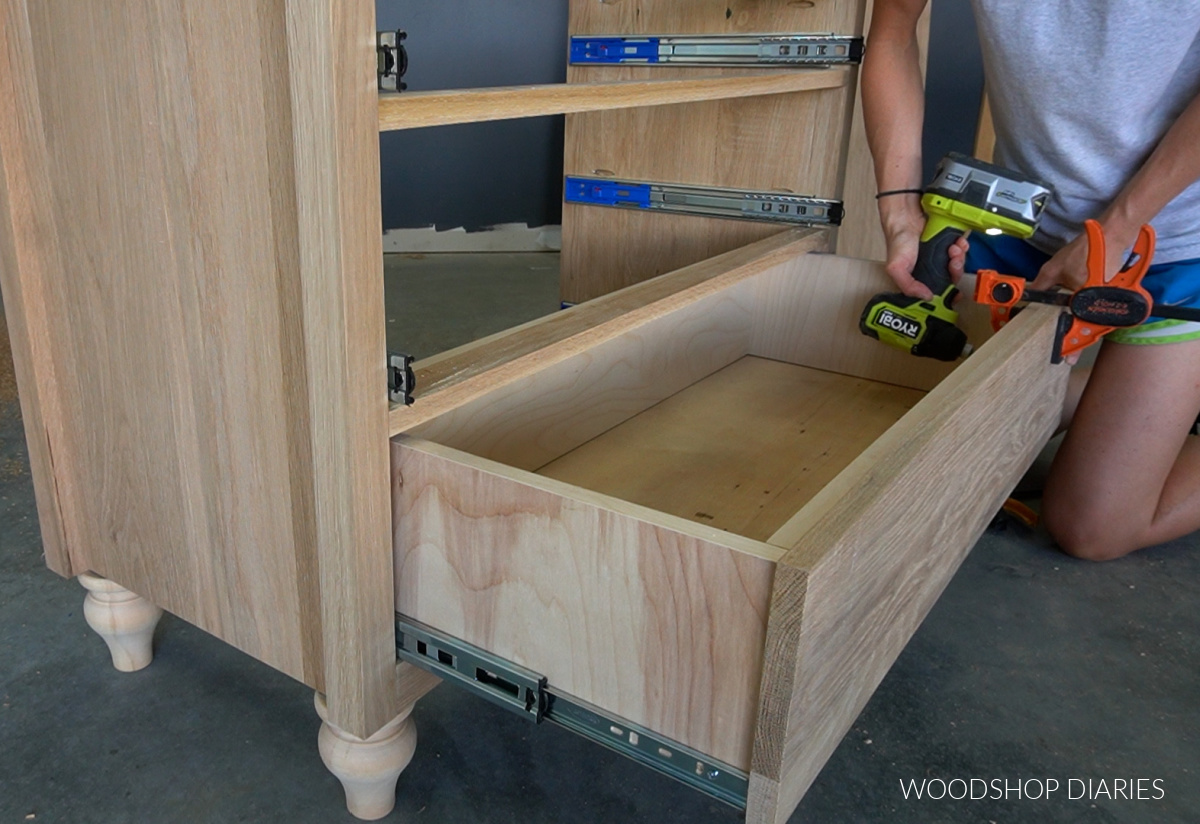 Shara Woodshop Diaries securing drawer fronts onto dresser drawers using Ryobi driver