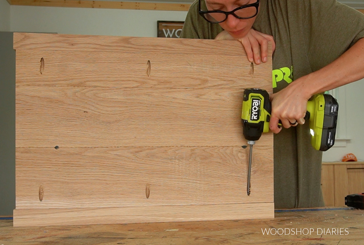 Shara Woodshop Diaries installing side panel between dresser corner posts