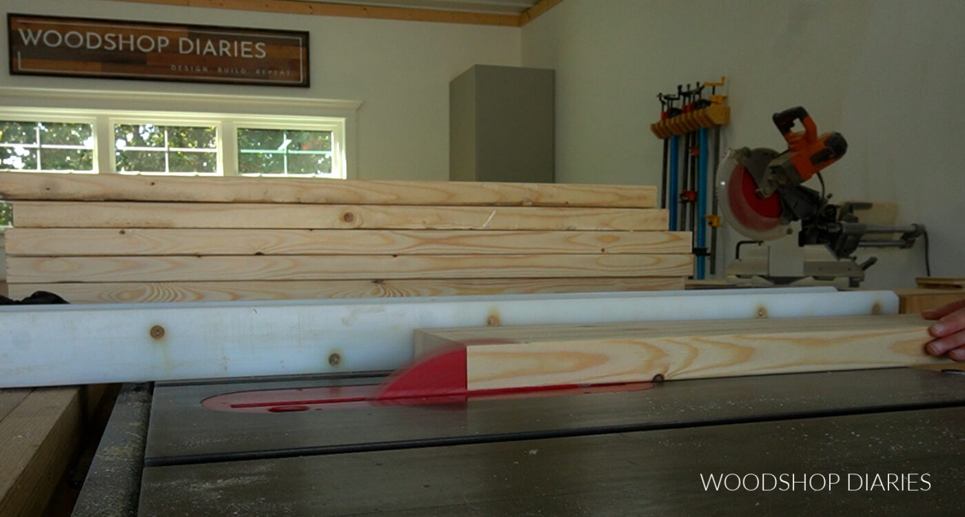 Running boards through table saw to square off rounded edges