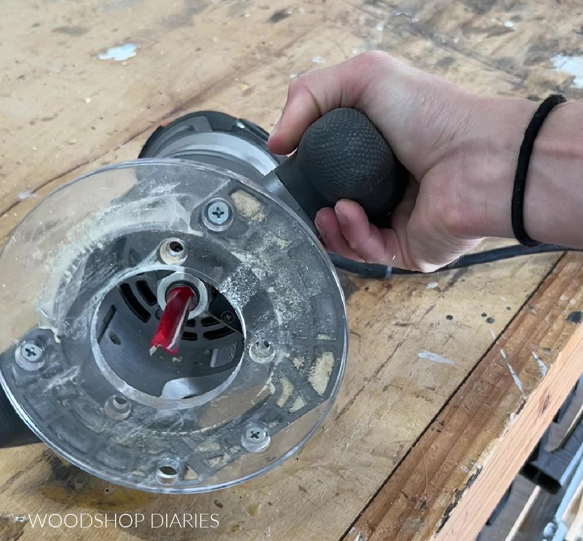 Close up of router sub plate showing screw locations