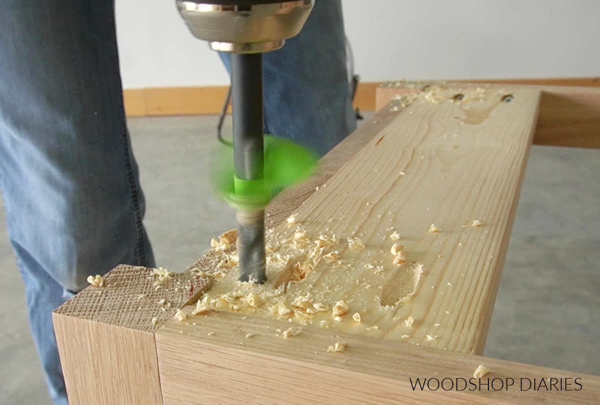 Drilling out hole in wood block to install threaded inserts