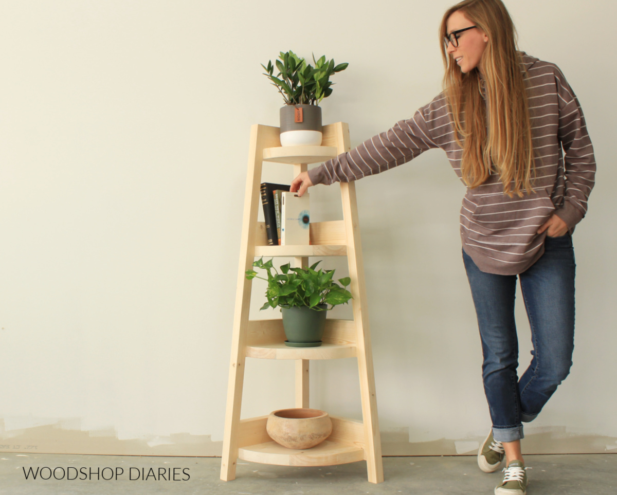 Shara next to DIY Corner shelf made from 2x6 boards