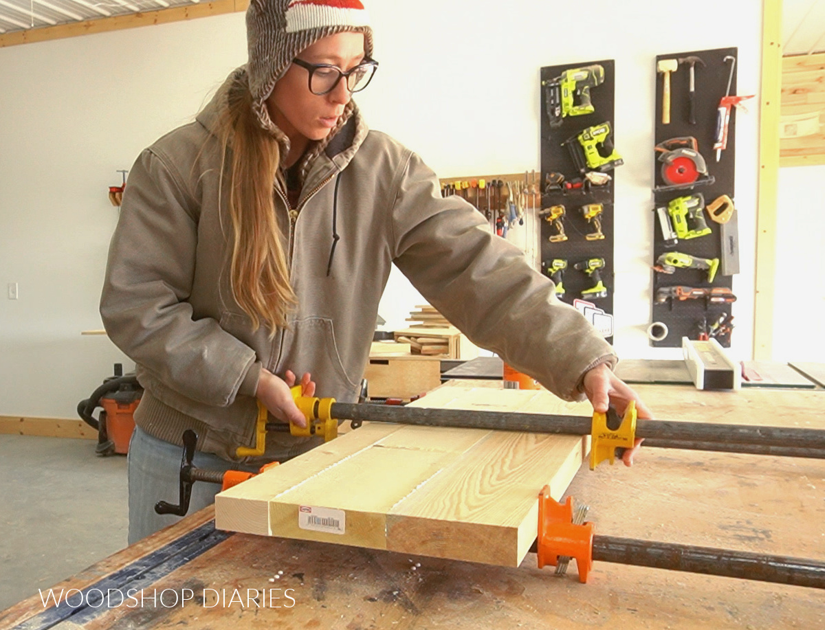 Shara Woodshop Diaries gluing up solid wood panel for cutting rounded shelving from