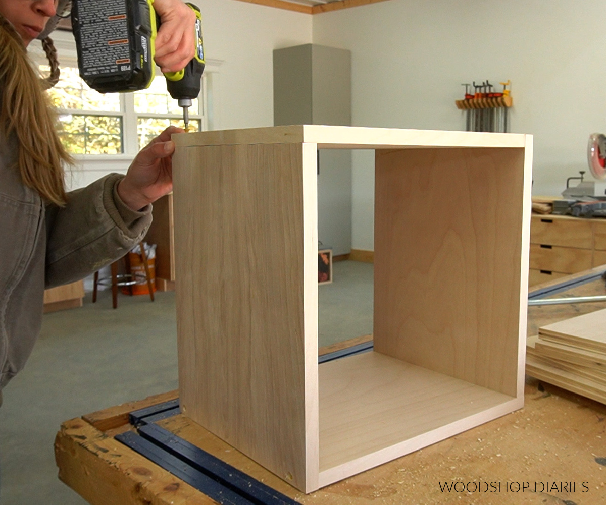 Shara Woodshop Diaries assembling geometric bookshelf boxes on workbench