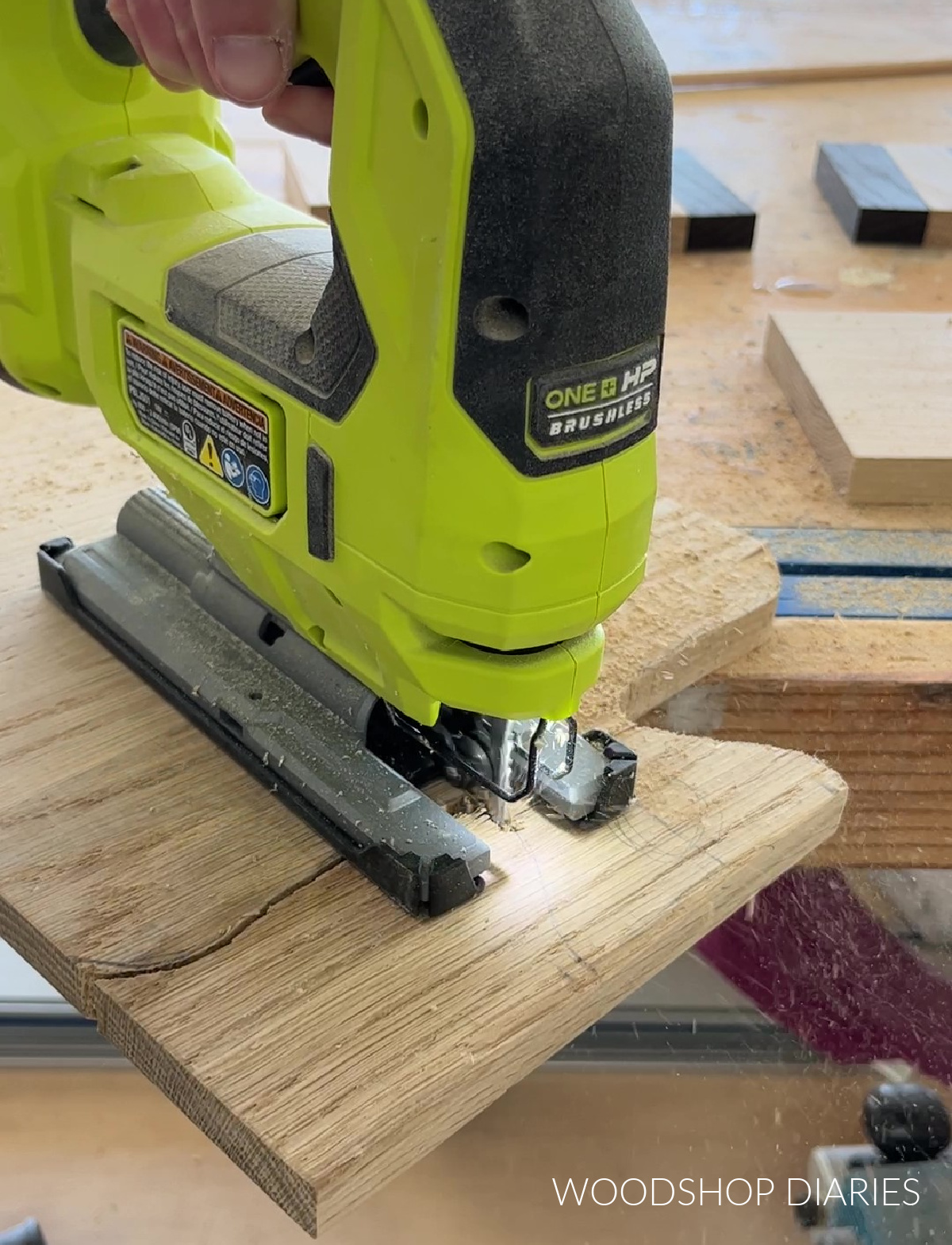 Using a jig saw to cut handle shape on cutting board