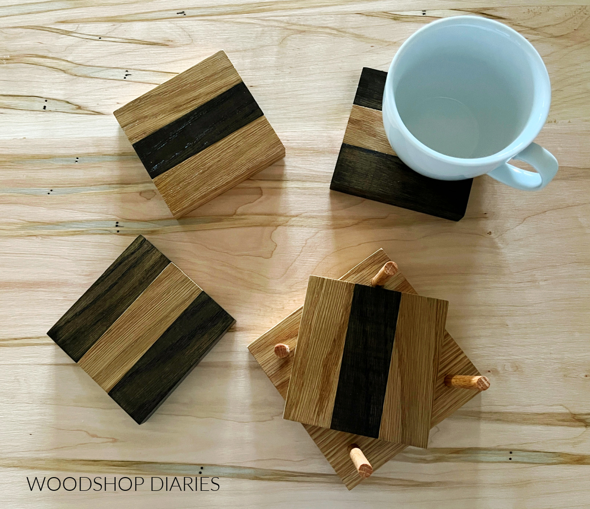 two tone scrap wood coasters on table top