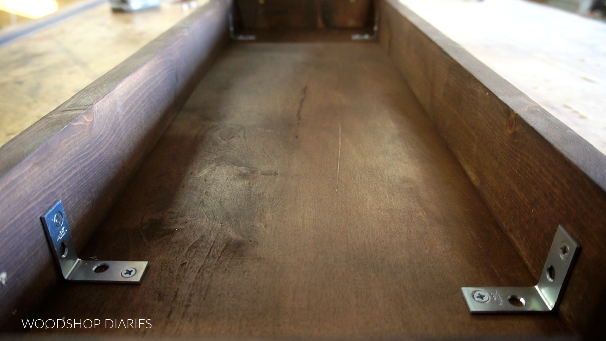 Inside view of underside of bench--showing L brackets used to secure top to frame