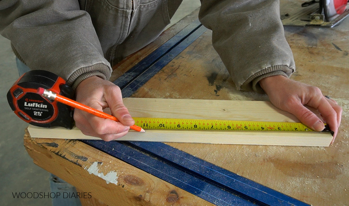 Measuring out 11" from the top edge of leg board on workbench